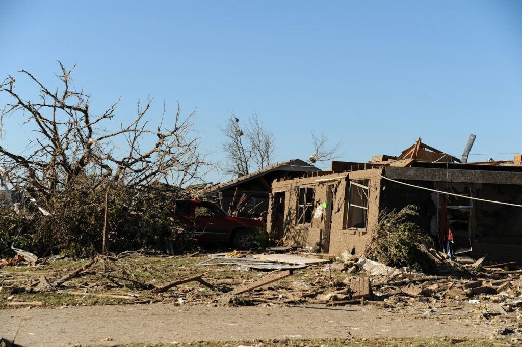 a house that has been destroyed by a tree
